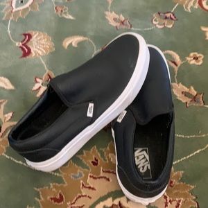 Women’s Vans Off the Wall Black leather slip on’s.